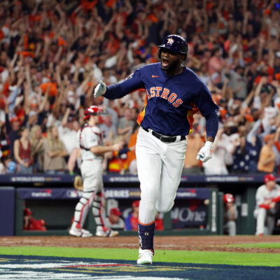 Yordan Alvarez of the Houston Astros hits a three-run home run against the Philadelphia Phillies during the sixth inning in Game Six of the 2022 World Series at Minute Maid Park.