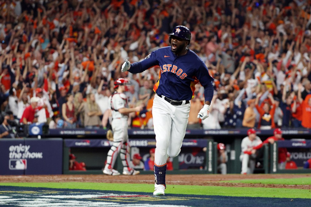 Yordan Alvarez of the Houston Astros hits a three-run home run against the Philadelphia Phillies during the sixth inning in Game Six of the 2022 World Series at Minute Maid Park.