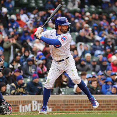 Dansby Swanson of the Chicago Cubs at bat against the Milwaukee Brewers during the ninth inning at Wrigley Field.