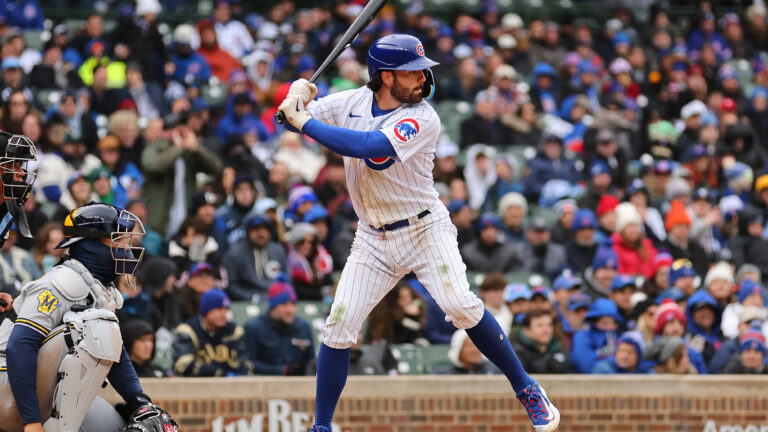 Dansby Swanson of the Chicago Cubs at bat against the Milwaukee Brewers during the ninth inning at Wrigley Field.
