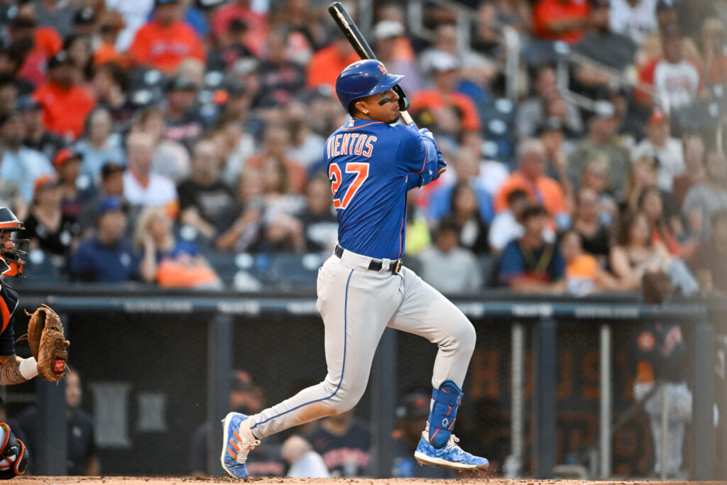 Mark Vientos of the New York Mets hits a double during the second inning of a spring training game against the Houston Astros at The Ballpark of the Palm Beaches.