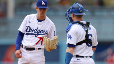 Gavin Stone #71 and Will Smith #16 of the Los Angeles Dodgers talk on the mound during the first inning against the Philadelphia Phillies at Dodger Stadium.