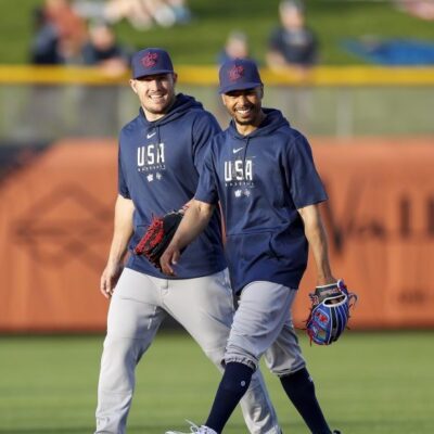 SCOTTSDALE, AZ - MARCH 08: Team USA right fielder Mookie Betts (3) smiles with center fielder Mike Trout (27) prior to a Spring Training exhibition game against the San Francisco Giants at Scottsdale Stadium on March 08, 2023 in Scottsdale, Arizona. (Photo by Brandon Sloter/Icon Sportswire via Getty Images)