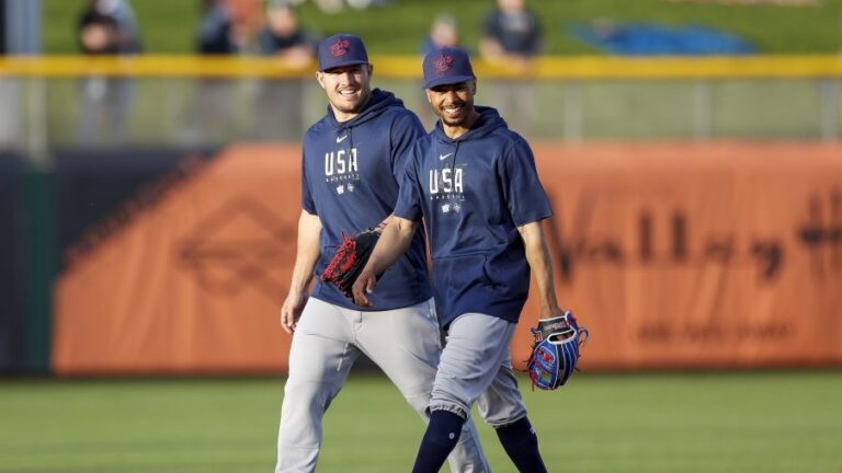 SCOTTSDALE, AZ - MARCH 08: Team USA right fielder Mookie Betts (3) smiles with center fielder Mike Trout (27) prior to a Spring Training exhibition game against the San Francisco Giants at Scottsdale Stadium on March 08, 2023 in Scottsdale, Arizona. (Photo by Brandon Sloter/Icon Sportswire via Getty Images)