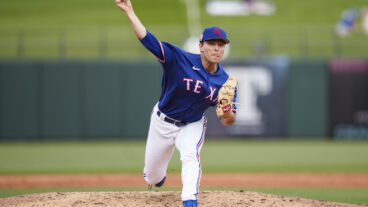 Jack Leiter of the Texas Rangers delivers a pitch during a spring training game against the Colorado Rockies at Surprise Stadium.