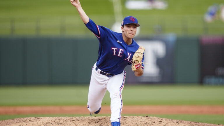 Jack Leiter of the Texas Rangers delivers a pitch during a spring training game against the Colorado Rockies at Surprise Stadium.