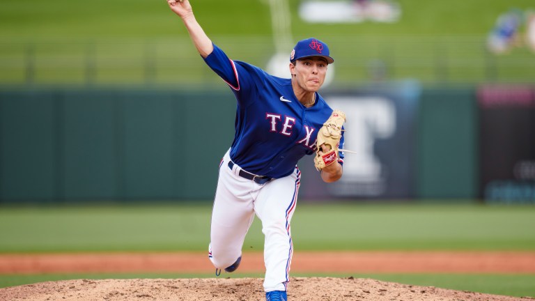 Jack Leiter of the Texas Rangers delivers a pitch during a spring training game against the Colorado Rockies at Surprise Stadium.