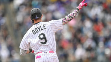 Brenton Doyle of the Colorado Rockies celebrates as he rounds the bases after hitting a fifth inning solo homerun in a game against the Philadelphia Phillies at Coors Field.