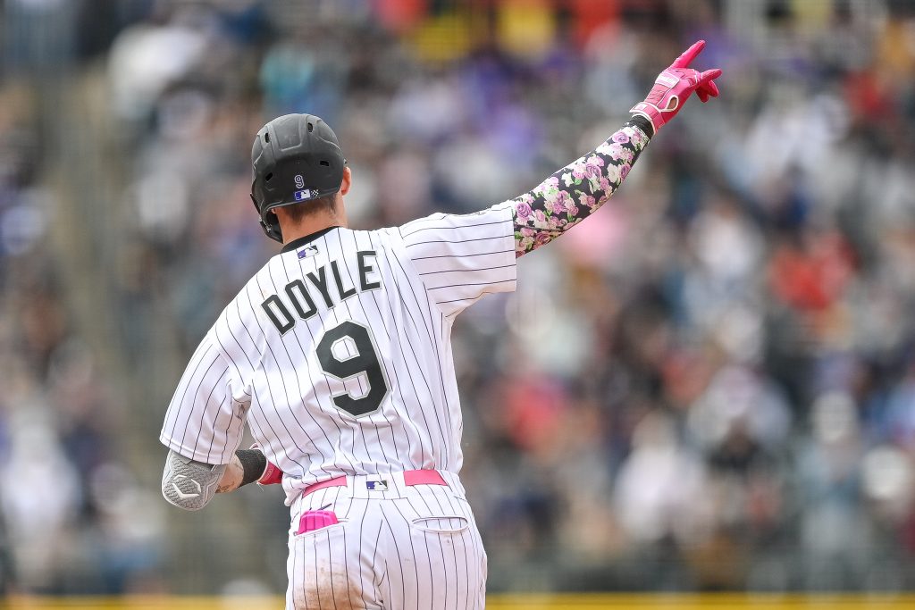Brenton Doyle of the Colorado Rockies celebrates as he rounds the bases after hitting a fifth inning solo homerun in a game against the Philadelphia Phillies at Coors Field.