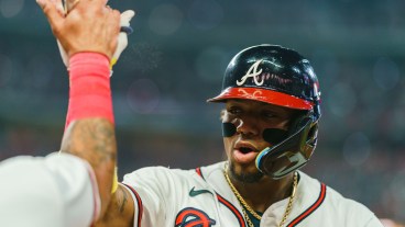 Ronald Acuña Jr. of the Atlanta Braves celebrates during the sixth inning against the New York Mets at Truist Park.