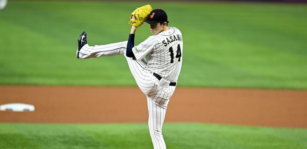  Roki Sasaki #14 of Team Japan pitches in the top of the first inning during the World Baseball Classic Semifinals between Mexico and Japan at loanDepot park.