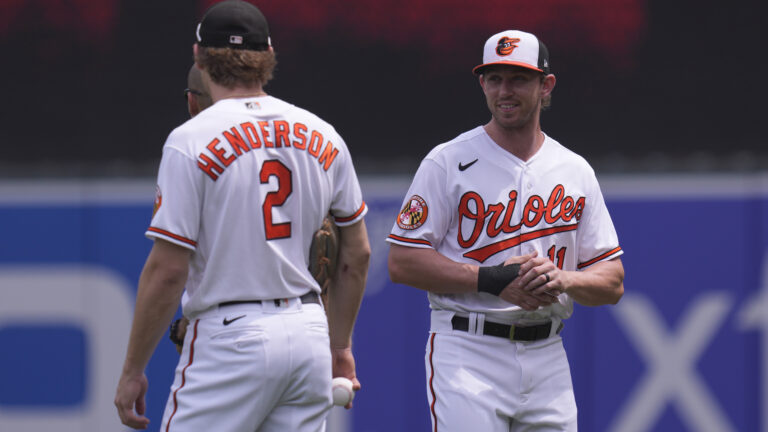 Gunnar Henderson #2 of the Baltimore Orioles and Jordan Westburg #11 chat before a game against the Minnesota Twins at Oriole Park at Camden Yards.