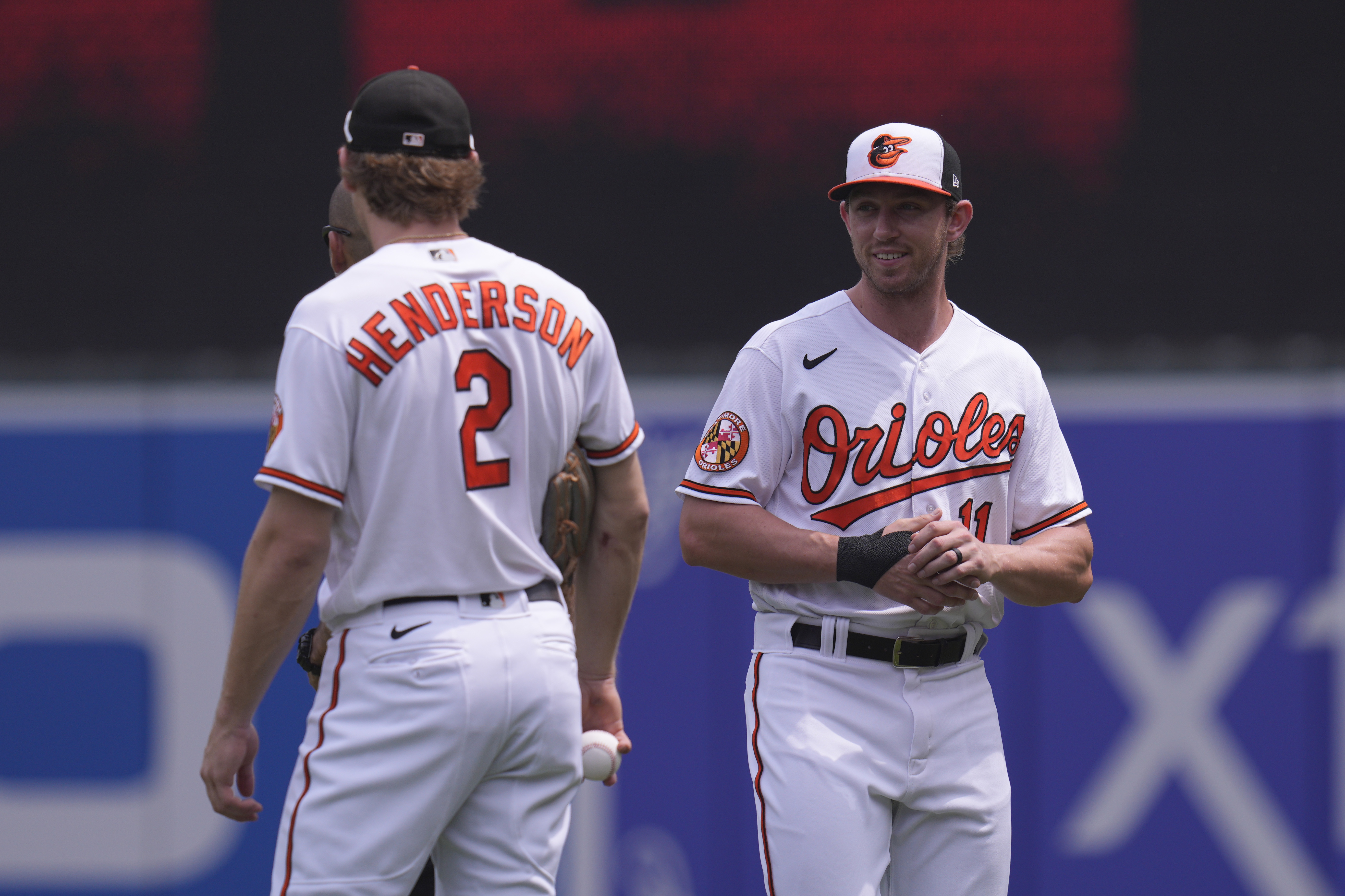 Gunnar Henderson #2 of the Baltimore Orioles and Jordan Westburg #11 chat before a game against the Minnesota Twins at Oriole Park at Camden Yards.