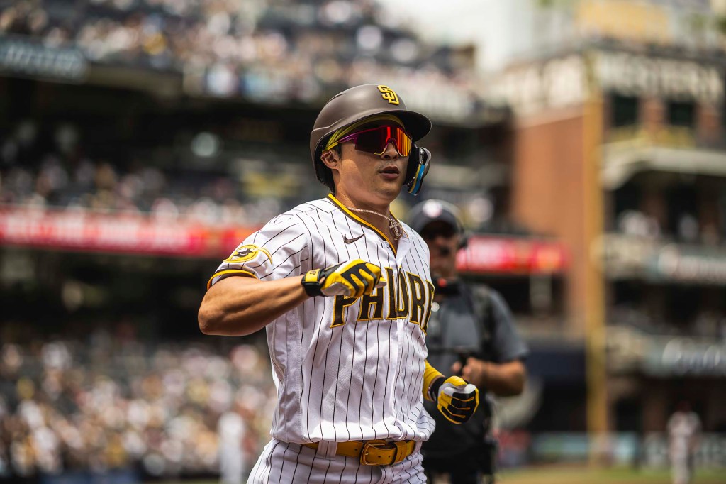 Ha-Seong Kim of the San Diego Padres celebrates after hitting a home run in the first inning during game one of a doubleheader game against the Arizona Diamondbacks at Petco Park.