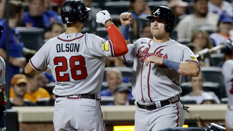 Matt Olson of the Atlanta Braves celebrates his eighth inning two-run home run against the New York Mets with teammate Austin Riley at Citi Field.