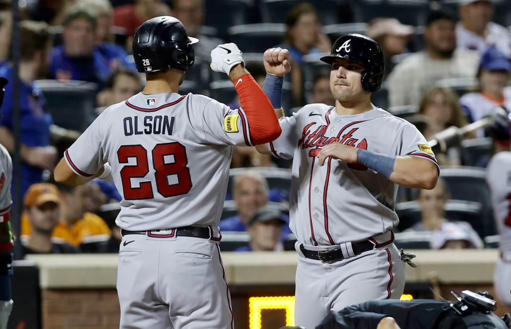 Matt Olson of the Atlanta Braves celebrates his eighth inning two-run home run against the New York Mets with teammate Austin Riley at Citi Field.
