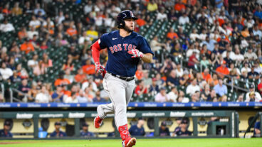 Wilyer Abreu of the Boston Red Sox hits a one run single in the eighth inning against the Houston Astros at Minute Maid Park.