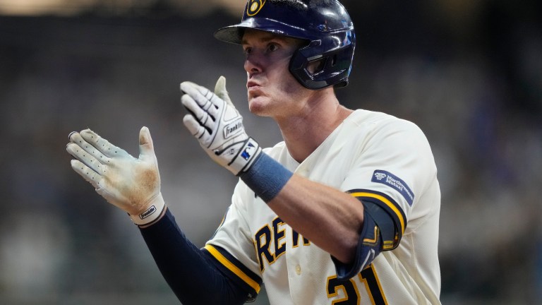 Mark Canha of the Milwaukee Brewers hits an RBI single during the eighth inning against the Arizona Diamondbacks in Game Two of the Wild Card Series at American Family Field.
