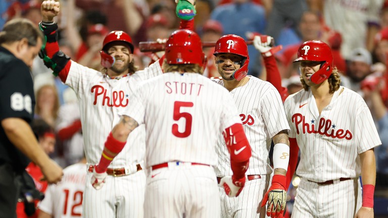 Bryson Stott of the Philadelphia Phillies celebrates with teammates after hitting a grand slam during the sixth inning against the Miami Marlins in Game Two of the Wild Card Series at Citizens Bank Park.