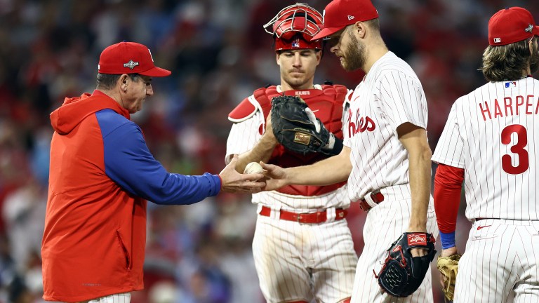 Manager Rob Thomson #59 takes Zack Wheeler #45 of the Philadelphia Phillies out against the Arizona Diamondbacks during the ninth inning in Game Seven of the Championship Series at Citizens Bank Park.