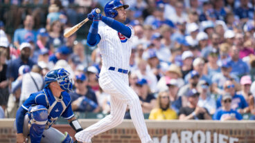 Cody Bellinger of the Chicago Cubs watches the flight of a home run in a game against the Kansas City Royals at Wrigley Field.