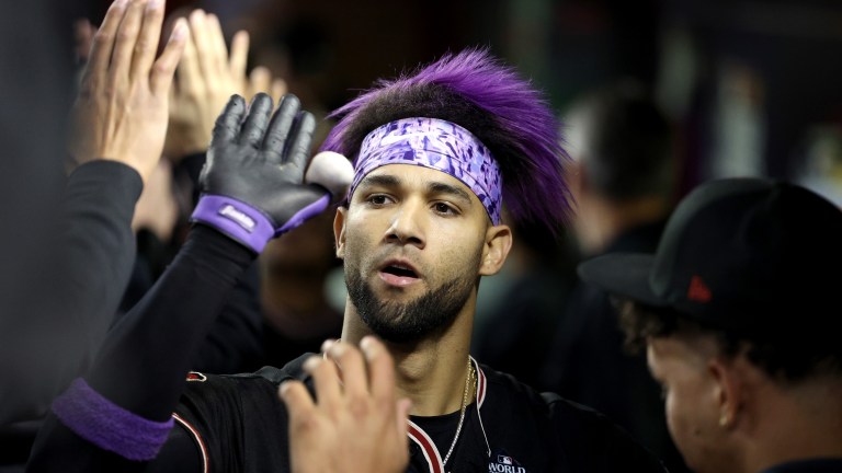 Lourdes Gurriel Jr. of the Arizona Diamondbacks celebrates with teammates after hitting a home run in the eighth inning against the Texas Rangers during Game Four of the World Series at Chase Field.