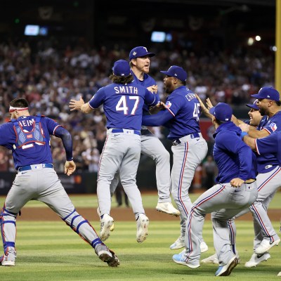 The Texas Rangers celebrate after beating the Arizona Diamondbacks 5-0 in Game Five to win the World Series at Chase Field.