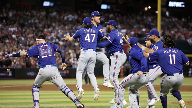 The Texas Rangers celebrate after beating the Arizona Diamondbacks 5-0 in Game Five to win the World Series at Chase Field.