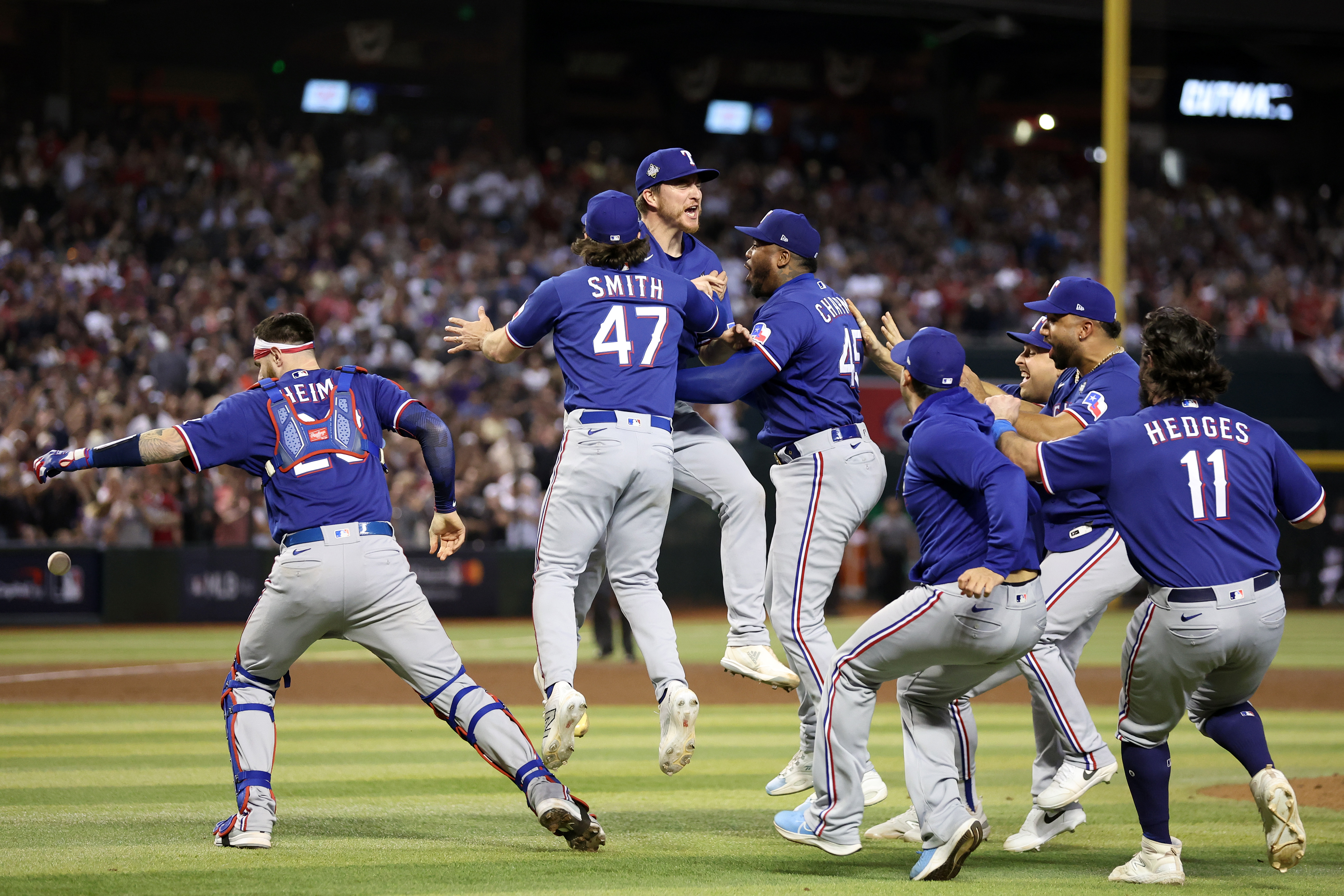The Texas Rangers celebrate after beating the Arizona Diamondbacks 5-0 in Game Five to win the World Series at Chase Field.