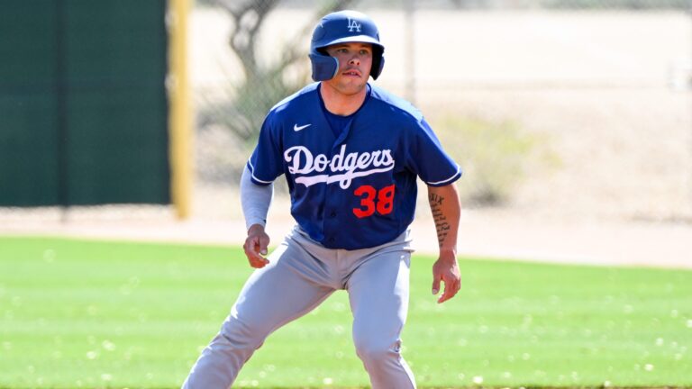 Dalton Rushing of the Los Angeles Dodgers takes a lead at first base during a minor league spring training game against the Cleveland Guardians at Camelback Ranch.