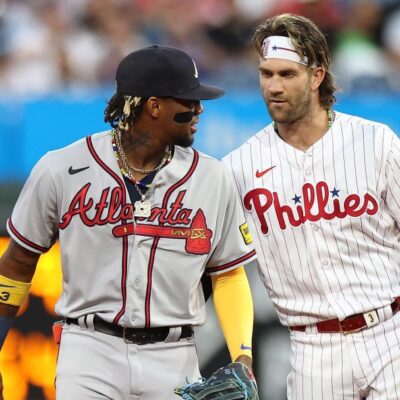 Ronald Acuna Jr. of the Atlanta Braves and Bryce Harper of the Philadelphia Phillies speak during the first inning at Citizens Bank Park.