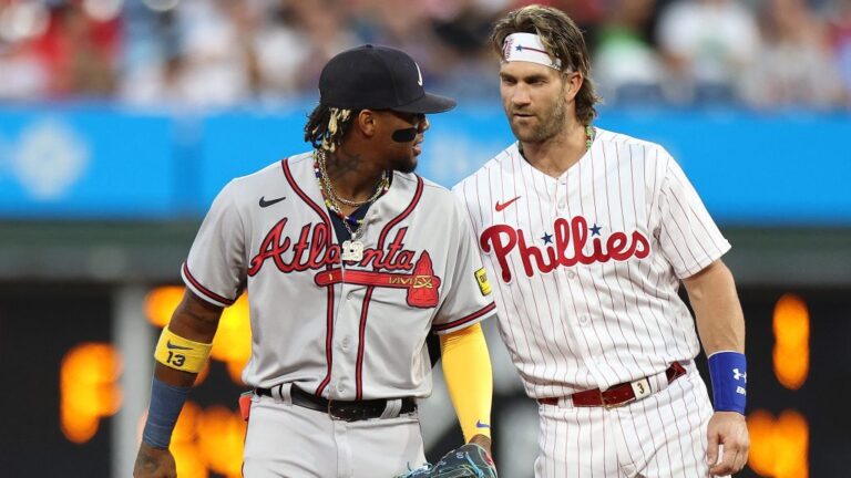 Ronald Acuna Jr. of the Atlanta Braves and Bryce Harper of the Philadelphia Phillies speak during the first inning at Citizens Bank Park.