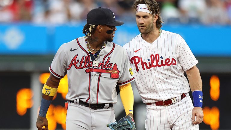 Ronald Acuna Jr. of the Atlanta Braves and Bryce Harper of the Philadelphia Phillies speak during the first inning at Citizens Bank Park.