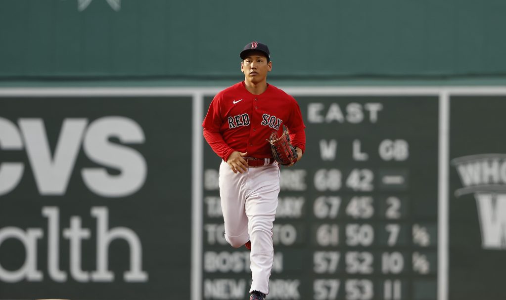 Masataka Yoshida of the Boston Red Sox runs in from left field against the Toronto Blue Jays during the ninth inning at Fenway Park.