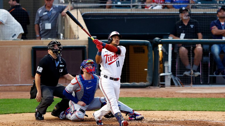 Jorge Polanco of the Minnesota Twins hits a solo home run against the Texas Rangers in the sixth inning at Target Field.