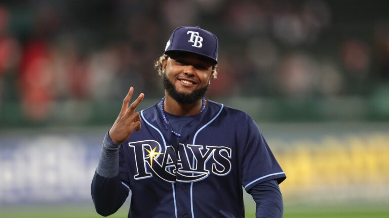 Junior Caminero of the Tampa Bay Rays warms up before playing against the Boston Red Sox at Fenway Park.