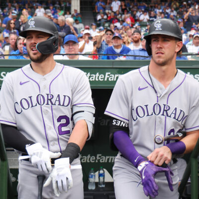 Kris Bryant #23 and Nolan Jones #22 of the Colorado Rockies look on against the Chicago Cubs at Wrigley Field on September 22, 2023 in Chicago, Illinois.