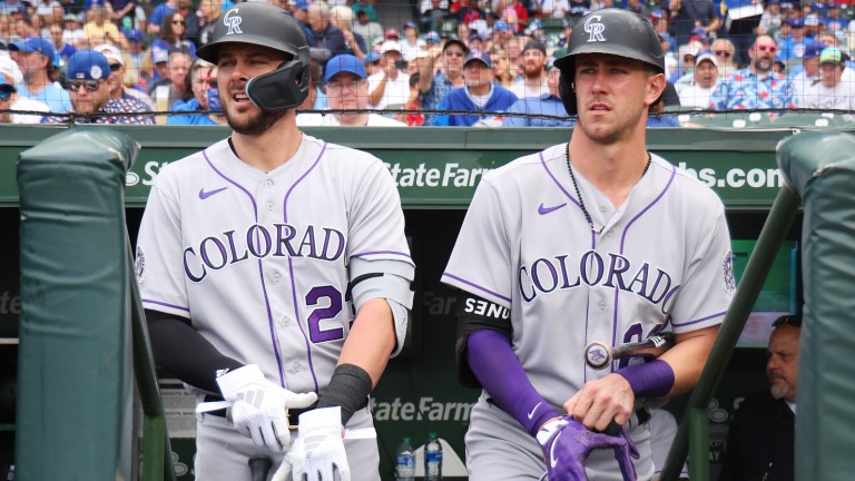 Kris Bryant #23 and Nolan Jones #22 of the Colorado Rockies look on against the Chicago Cubs at Wrigley Field on September 22, 2023 in Chicago, Illinois.