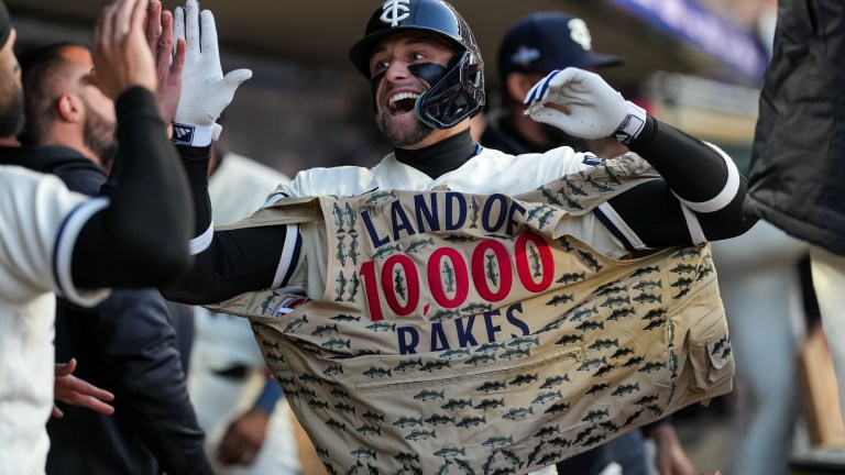 Royce Lewis of the Minnesota Twins celebrates in the dugout after hitting a home run during game four of the Division Series against the Houston Astros on October 11, 2023 at Target Field.