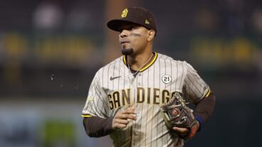 Xander Bogaerts of the San Diego Padres looks on between innings against the Oakland Athletics at RingCentral Coliseum.