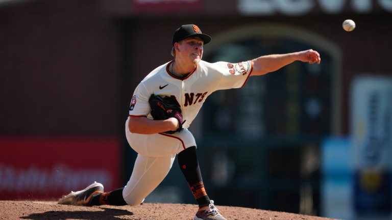 Kyle Harrison of the San Francisco Giants pitching against the Los Angeles Dodgers at Oracle Park.