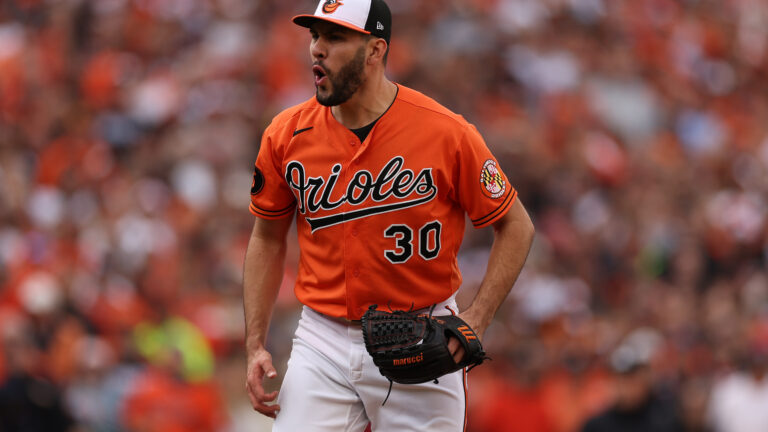 Grayson Rodriguez #30 of the Baltimore Orioles reacts against the Texas Rangers during Game Two of the American League Division Series at Oriole Park at Camden Yards.