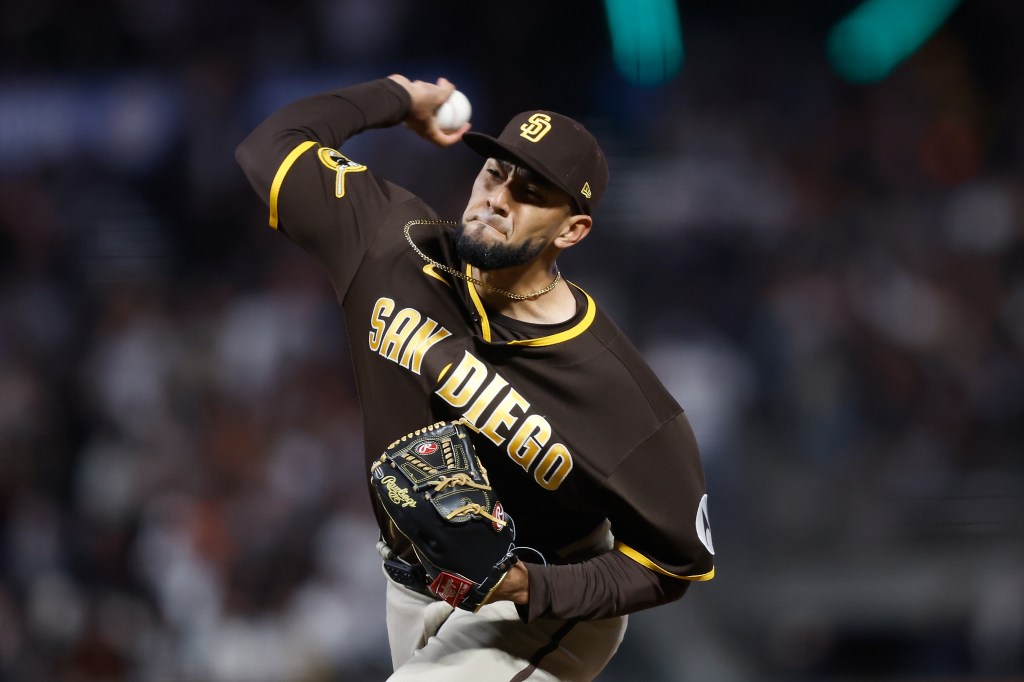 Robert Suarez of the San Diego Padres pitches against the San Francisco Giants at Oracle Park.