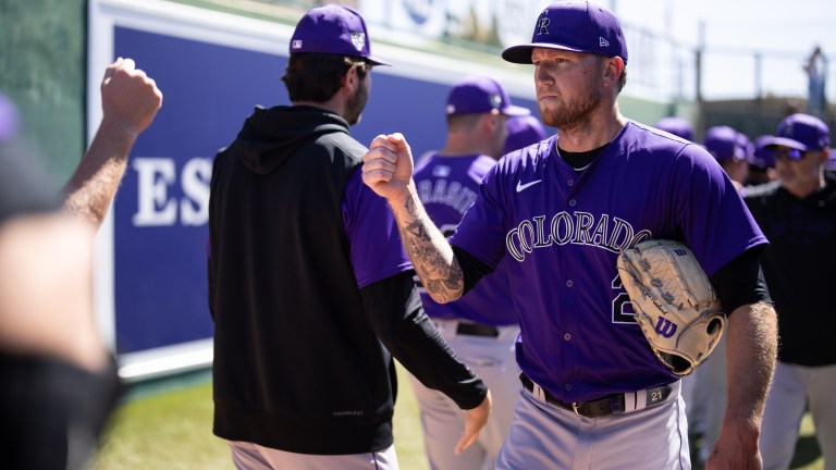Kyle Freeland of the Colorado Rockies fist bumps teammates prior to a start against the White Sox at Camelback Ranch.