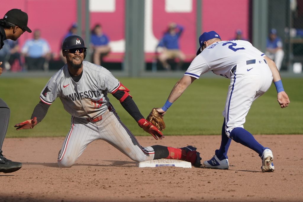 Byron Buxton of the Minnesota Twins celebrates an RBI double against Garrett Hampson of the Kansas City Royals at Kauffman Stadium.