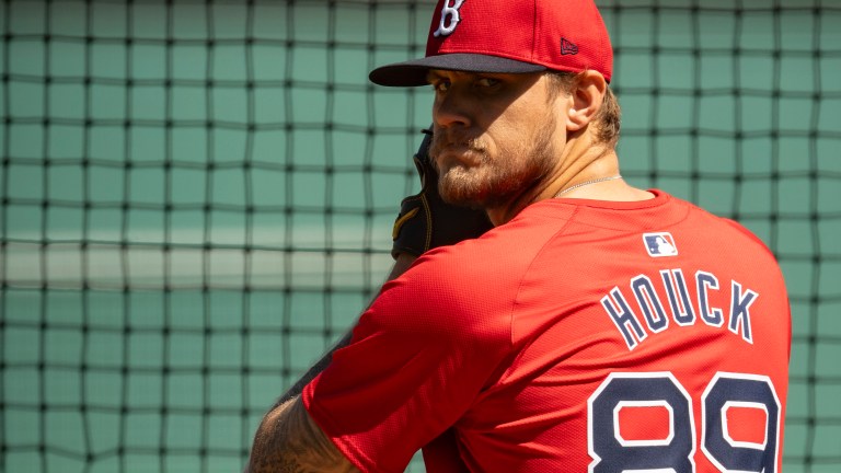 Tanner Houck of the Boston Red Sox pitches during live batting practice during a spring training team workout on February 21, 2024 at jetBlue Park at Fenway South.