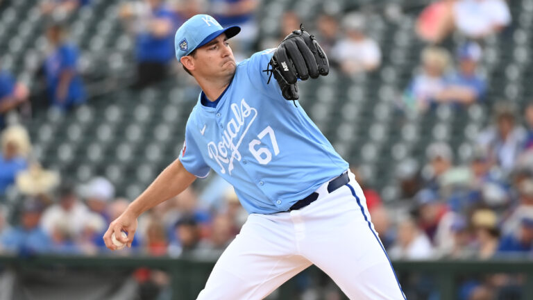 Seth Lugo #67 of the Kansas City Royals delivers a pitch against the Chicago Cubs during a spring training game at Surprise Stadium.