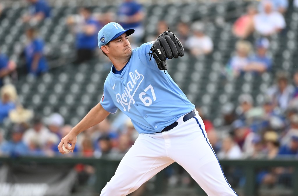Seth Lugo #67 of the Kansas City Royals delivers a pitch against the Chicago Cubs during a spring training game at Surprise Stadium.