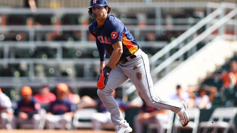 Joey Loperfido of the Houston Astros runs to second base against the Miami Marlins during the second inning in a spring training game at Roger Dean Stadium.