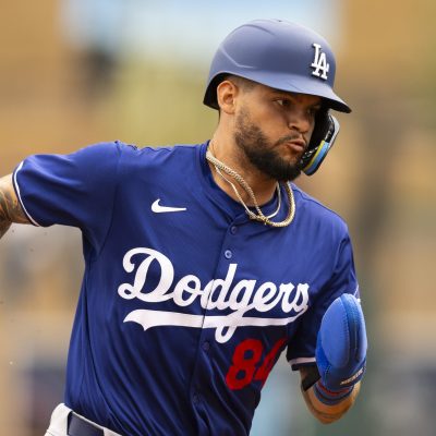 Andy Pages of the Los Angeles Dodgers runs to third base during the 2024 Spring Training Game between Los Angeles Dodgers and Colorado Rockies at Salt River Fields.